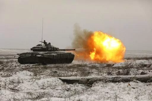 A Russian tank T-72B3 fires as troops take part in drills at the Kadamovskiy firing range in the Rostov region in southern Russia, on Jan. 12, 2022. The failure of last week's high-stakes diplomatic meetings to resolve escalating tensions over Ukraine has put Russia, the United States and its European allies in uncharted post-Cold War territory.(AP Photo)