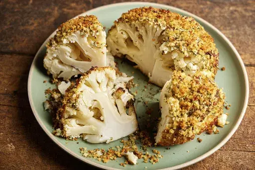 This image released by Milk Street shows a recipe for roasted "corned" cauliflower. (Milk Street via AP)