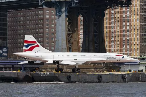 A retired British Airways Concorde supersonic aircraft is transported by barge on the East River, Wednesday, March 13, 2024, in New York. (AP Photo/Peter K. Afriyie)