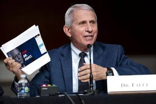 Dr. Anthony Fauci, director of the National Institute of Allergy and Infectious Diseases and chief medical adviser to the president, speaks during a Senate Health, Education, Labor, and Pensions Committee hearing Tuesday, Jan. 11, 2022 on Capitol Hill in Washington. Speaking Tuesday night, April 26, 2022, on PBS’ “NewsHour,” Fauci said the global pandemic isn’t over but the U.S. currently is “out of the pandemic phase.” But it doesn’t mean the coronavirus threat to Americans has en