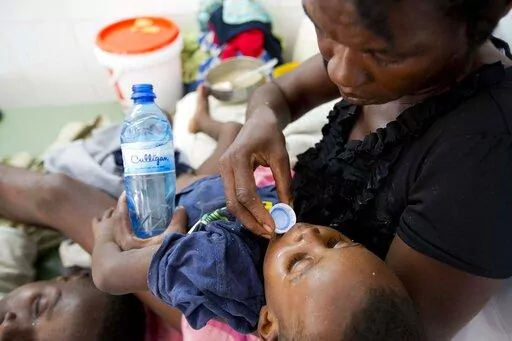 A boy diagnosed with cholera receives treatment at a cholera center in Anse D'Hainault, Haiti, Tuesday, Oct. 11, 2016. Haiti’s government on Sunday, Oct. 2, 2022, announced that at least eight people have died from cholera for the first time in three years, raising concerns about another potential catastrophic epidemic like the one that broke out a decade ago and killed nearly 10,000 people. (AP Photo/Dieu Nalio Chery, File)