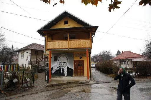 A man walks past a mural depicting Vladimir Putin, in Zvecan, Kosovo, Dec. 15, 2018. For some European countries watching Russia's bloody invasion of Ukraine, there are fears that they could be next. Western officials say the most vulnerable could be those who are not members of the NATO military alliance or the European Union, and thus alone and unprotected — including Ukraine’s neighbor Moldova and Russia's neighbor Georgia, both of them formerly part of the Soviet Union — along with the