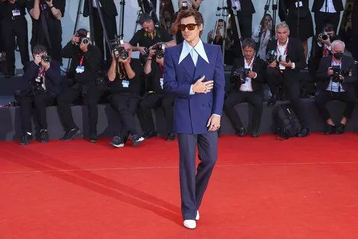 Harry Styles poses for photographers upon arrival at the premiere of the film 'Don't Worry Darling' during the 79th edition of the Venice Film Festival in Venice, Italy, Monday, Sept. 5, 2022. (Photo by Joel C Ryan/Invision/AP)