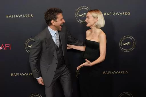 Bradley Cooper, left, and Carey Mulligan arrive at the AFI Awards on Friday, Jan. 12, 2024, at the Four Seasons Beverly Hills in Beverly Hills, Calif. (AP Photo/Chris Pizzello)