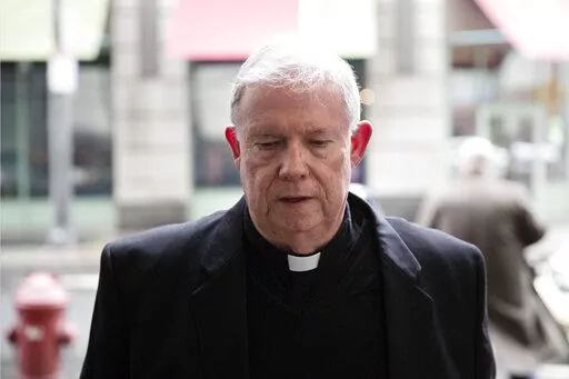 FILE – Monsignor William Lynn arrives for a preliminary hearing in his retrial of his child endangerment case at the Center for Criminal Justice in Philadelphia, March 28, 2017. Lynn, the longtime secretary for clergy, was accused of sending a known predator, named on a list of problem priests he had prepared for Cardinal Bevilacqua, to an accuser’s northeast Philadelphia parish. Lynn served nearly three years in state prison before appeals courts threw out his felony child endangerment conv