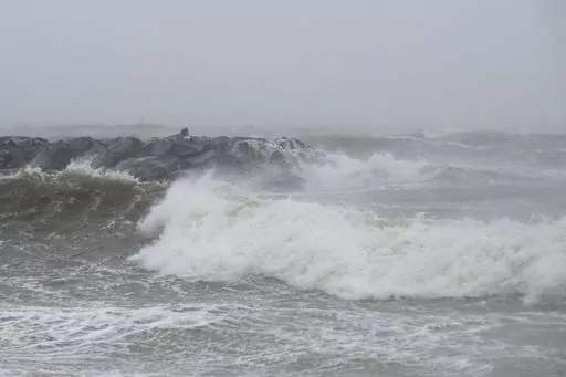 Waves crash at Outlook Beach in Hampton, Va., Sept. 30, 2022. Storms with strong gusting winds sometimes cause a phenomenon known as a meteotsunami, in which the winds push on the water and increase the wave height near the coast before it eventually crashes onto shore. (Billy Schuerman/The Virginian-Pilot via AP, File)