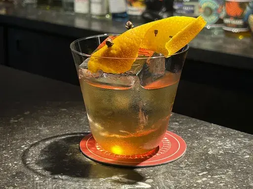 This undated image shows a roasted chestnut old fashioned cocktail from Archive & Myth bar in London. (AP Photo/Louise Dixon)