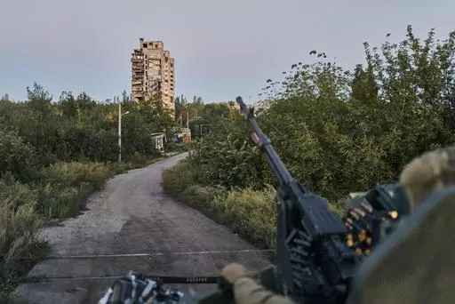 A Ukrainian soldier sits in his position in Avdiivka, Donetsk region, Ukraine, on Aug. 18, 2023. Ukrainian troops are under intense pressure from a determined Russian effort to storm the strategically important eastern Ukraine city of Avdiivka, officials say. Kyiv’s army is struggling with ammunition shortages as the Kremlin’s forces pursue a battlefield triumph around the two-year anniversary of Moscow’s full-scale invasion and ahead of a March presidential election in Russia. (AP Photo/L