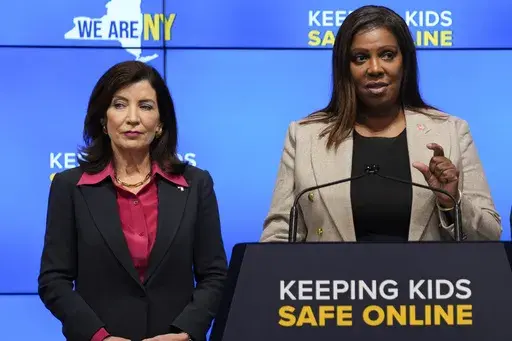 New York Gov. Kathy Hochul, left, listens as Attorney General Letitia James speaks during a news conference in New York, Oct. 11, 2023. New York lawmakers on Tuesday, June 4, said they were finalizing legislation that would allow parents to block their children from getting social media posts curated by a platform's algorithm, a move to rein in feeds that critics argue keep young users glued to their screens. Hochul and James have been advocating for the regulations since October, facing strong 