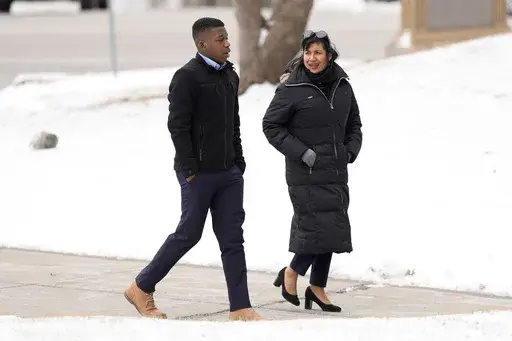 Ralph Yarl walks to the Clay County Courthouse to attend a hearing for Andrew Lester, who pleaded guilty in charges stemming from a 2023 incident when Lester shot Yarl in the head after Yarl mistakenly knocked on the Lester's door, Friday, Feb. 14, 2025, in Liberty, Mo. (AP Photo/Charlie Riedel)