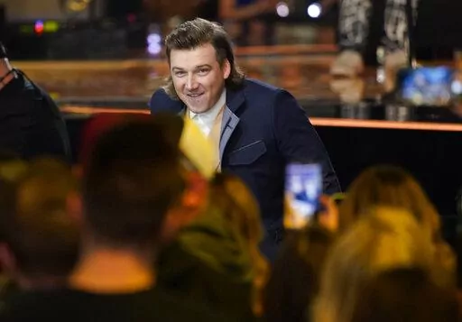 Morgan Wallen accepts the award for album of the year for "Dangerous: The Double Album" at the 57th Academy of Country Music Awards on Monday, March 7, 2022, at Allegiant Stadium in Las Vegas. (AP Photo/John Locher)