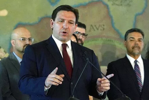 Florida Gov. Ron DeSantis speaks at Miami's Freedom Tower, on May 9, 2022. The Special Olympics has dropped a coronavirus vaccine mandate for its games in Orlando after Florida moved to fine the organization $27.5 million for violating a state law against such rules.  DeSantis, on Friday, June 3, 2022,  announced that the organization had removed the requirement for its competition in the state, which is scheduled to run June 5 to June 12. (AP Photo/Marta Lavandier, File)