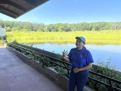 University of Wisconsin-Madison senior Arianna Barajas talks about whooping cranes on Tuesday, Aug. 15, 2023, near Baraboo, Wis. Barajas, who identifies as Mexican-American, is spending the summer working for the International Crane Foundation as part of the Natural Resources Foundation of Wisconsin's Diversity in Conservation Internships. (AP Photo/Todd Richmond)