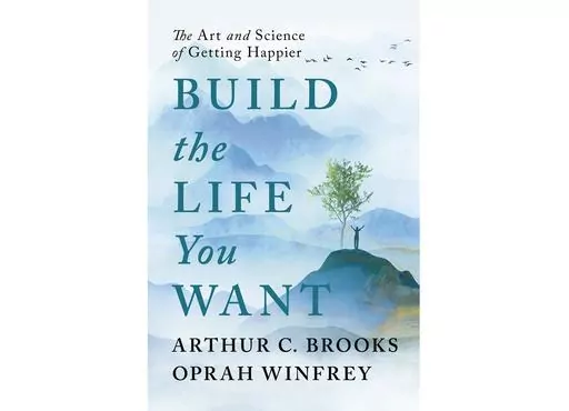 This cover image released by Portfolio Books shows “Build the Life You Want: The Art and Science of Getting Happier,” by Arthur C. Brooks and Oprah Winfrey, to be published Sept. 12 by Portfolio Books (Portfolio Books via AP)