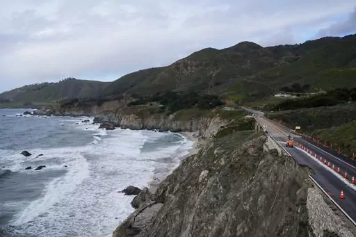 The collapsed section of the southbound lane of Highway 1 at Rocky Creek Bridge is marked off by cones Thursday, April 4, 2024, in Big Sur, Calif. The break has caused the closure of the scenic road. (AP Photo/Godofredo A. Vásquez)