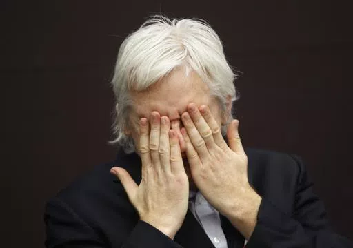 WikiLeaks founder Julian Assange gestures as he talks during a news conference in central London, on Dec. 1, 2011. Assange faces a key hearing Monday May 20, 2024 in his decade-and-a-half-long attempt to avoid extradition to the United States on espionage charges. (AP Photo/Lefteris Pitarakis, File)