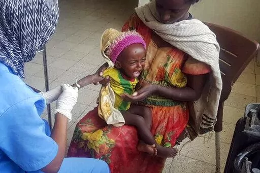 Medhin Gereziher, 1, is treated for malnutrition at the Ayder Referral Hospital in Mekele, in the Tigray region of northern Ethiopia Tuesday, Oct. 4, 2022. Babies are dying in their first month of life at four times the rate they did before the war in Ethiopia's Tigray region, according to a yet-unpublished study shared by its authors with The Associated Press. (AP Photo)