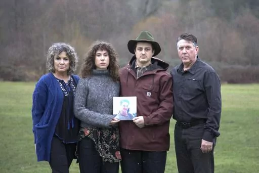 In this undated image provided by Haylee Wendling, family members of Colin Conner pose for a photo as they hold an image of Colin. Conner, who struggled with opioid addiction for years, lost his life to a fentanyl overdose in June 2023, just days after being released from a Salt Lake City jail. Conner's father said the jail had discontinued his methadone prescription, causing him to go through agonizing withdrawal and prompting cravings to return while he was behind bars. (Haylee Wendling via AP