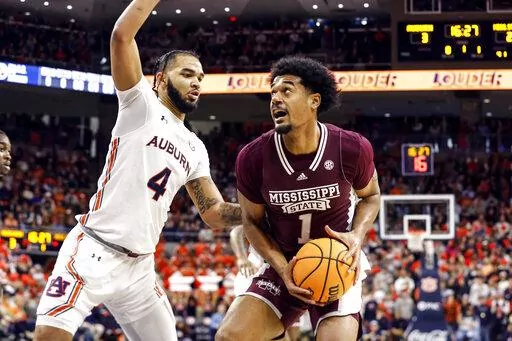 Mississippi State forward Tolu Smith (1) looks for a shot as Auburn forward Johni Broome (4) defends during the first half of an NCAA college basketball game Saturday, Jan. 14, 2023 in Auburn, Ala.. (AP Photo/Butch Dill)
