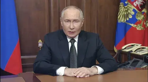 In this image made from video released by the Russian Presidential Press Service, Russian President Vladimir Putin addressees the nation at the Kremlin in Moscow, Russia, Thursday, Nov. 21, 2024. (Russian Presidential Press Service via AP)