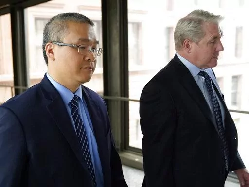 Former Minneapolis police officer Tou Thao, left, and his attorney Robert Paule arrive for sentencing for violating George Floyd's civil rights outside the Federal Courthouse Wednesday, July 27, 2022, in St. Paul, Minn. A judge has scheduled a hearing for Monday, Aug. 15, 2022, on the status of plea negotiations in the case of the two remaining officers awaiting trial on state charges in the murder of George Floyd. Thao and J. Alexander Kueng face a late October trial. (David Joles/Star Tribune 