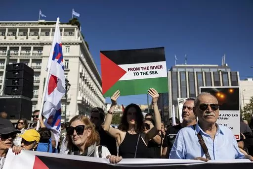 Pro-Palestinian protesters take part in a rally to express solidarity with Palestinians, in front of the parliament, in Athens, Greece, Sunday, Nov. 5, 2023. The Jordan River is a winding, 200-plus-mile run to the east of Israel and the West Bank. The sea is the glittering Mediterranean to its west. But a phrase about the space in-between, “from the river to the sea,” has become a battle cry with new power to roil Jews and pro-Palestinian activists in the aftermath of Hamas’ murderous ramp