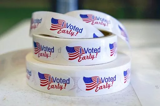 Rolls of "I Voted Early" stickers await voters in the final hours of early voting in the primary election in Noblesville, Ind., May 2, 2022. Election Day is still 12 days away. But in courtrooms across the country, efforts to sow doubt over the outcome have already begun. (AP Photo/Michael Conroy, File)