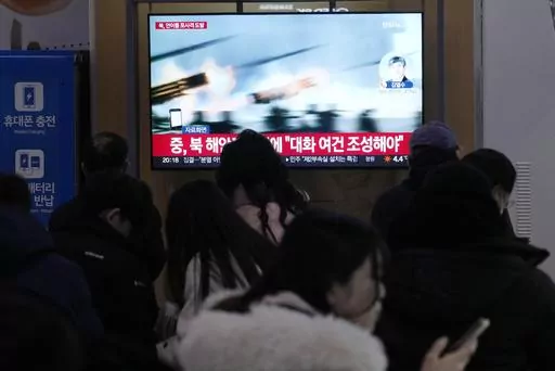 A TV screen shows a file image of North Korea's military exercise during a news program at the Seoul Railway Station in Seoul, South Korea, Saturday, Jan. 6, 2024. North Korea conducted a new round of artillery drills near the disputed sea boundary with South Korea on Saturday, officials in Seoul said, a day after the North's earlier exercises prompted South Korea to respond with its own drills in the same area. (AP Photo/Ahn Young-joon)