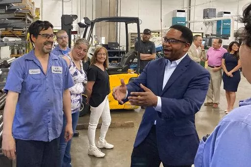 Republican candidate for Illinois governor Richard Irvin speaks with employees during a tour of HM Manufacturing Inc. in Wauconda, Ill., June 21, 2022. Irvin is seeking the Republican nomination to face Democratic Gov. J.B. Pritzker in November. (AP Photo/Sara Burnett, File)