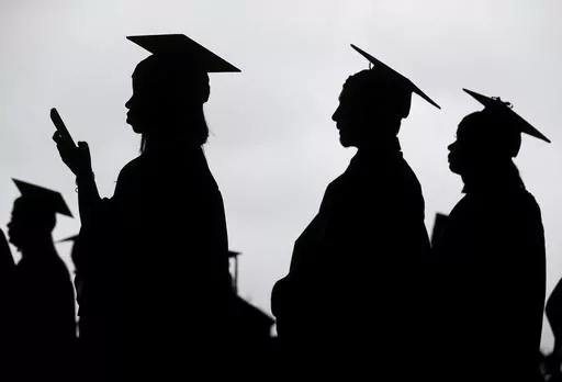 New graduates line up before the start of a community college commencement in East Rutherford, N.J., on May 17, 2018. The Supreme Court struck down the Biden administration’s plan to forgive up to $20,000 of student loan debt per borrower, yet loan forgiveness is still possible for those pursuing Public Service Loan Forgiveness or income-driven repayment forgiveness. A one-time account adjustment that began in July 2023 is still ongoing and gives credit for certain periods of deferment, forbea