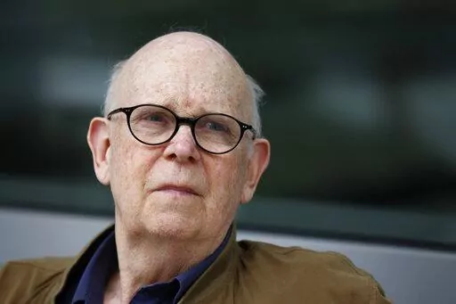 Pop artist Claes Oldenburg watches as his sculpture "Paint Torch" is installed by the George Young Company at the Pennsylvania Academy of the Fine Arts in Philadelphia on Saturday, Aug. 20, 2011. Oldenburg died Monday, July 18, 2022, in Manhattan, according to his daughter, Maartje Oldenburg. He had been in poor health since falling and breaking his hip a month ago. He was 93. (AP Photo/Alex Brandon, File)