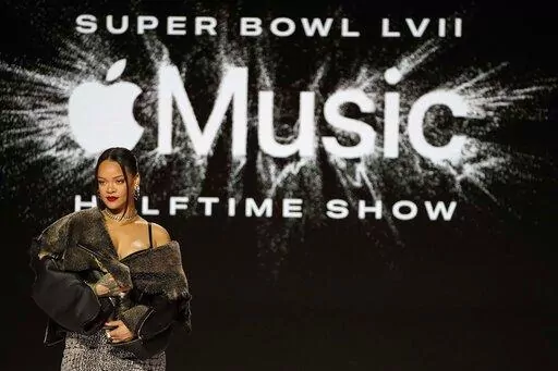Rihanna poses for a photo after a halftime show news conference ahead of the Super Bowl 57 NFL football game, Thursday, Feb. 9, 2023, in Phoenix. (AP Photo/Mike Stewart)