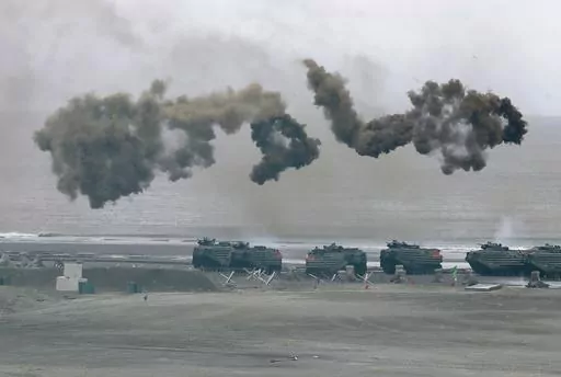 Taiwan's military holds drills of the annual Han Kuang military exercises that simulate an anti-landing operations near the coast in New Taipei City, northern Taiwan, Thursday, July 27, 2023. Taiwan military mobilized for routine defense exercises from July 24-28. The U.S. is set to announce $345 million in military aid for Taiwan, two U.S. officials said Friday. It would be the Biden administration's first major package drawing on America's own stockpiles under a new policy intended to speed up