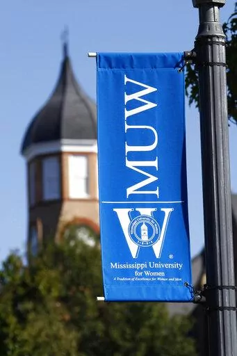  A banner for Mississippi University for Women hangs at the campus in Columbus, Miss., on Oct. 27, 2008. President Nora Miller said in a letter to alumni in the fall semester of 2022 that the university, which has also been enrolling men for 40 years, should consider a new name that is more inclusive. (AP Photo/Rogelio V. Solis, File)