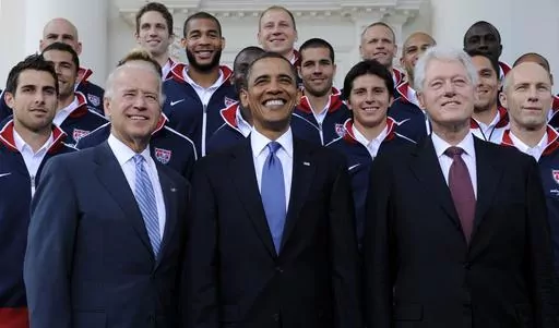 President Barack Obama, flanked by Vice President Joe Biden, left, and former President Bill Clinton, right, pose for a photo with the U.S. World Cup soccer team under the North Portico of the White House in Washington, May 27, 2010. President Joe Biden will share a stage with Barack Obama and Bill Clinton on Thursday in New York as he raises money for his reelection campaign. It's a one-of-a-kind political extravaganza that will showcase decades of Democratic leadership. (AP Photo/Susan Walsh, 