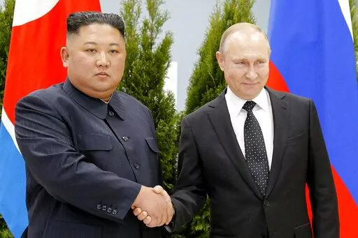 Russian President Vladimir Putin, right, and North Korea's leader Kim Jong Un shake hands during their meeting in Vladivostok, Russia on April 25, 2019. North Korea on Tuesday, Nov. 8, 2022 accused the United States of cooking up a "plot-breeding story" on its alleged arms transfer to Russia, arguing it has never sent artillery shells to Moscow. (AP Photo/Alexander Zemlianichenko, Pool, File)