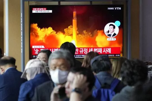 A TV screen shows a file image of North Korea's missile launch during a news program at the Seoul Railway Station in Seoul, South Korea, Friday, Oct. 14, 2022. North Korea early Friday launched a short-range ballistic missile toward its eastern waters and flew warplanes near the border with South Korea, further raising animosities triggered by the North's recent barrage of weapons tests. (AP Photo/Ahn Young-joon)