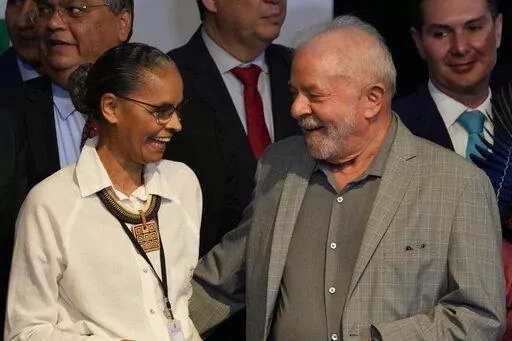 Brazil's President-elect Luiz Inacio Lula da Silva and newly-named Environment Minister Marina Silva, smile during a meeting where he announced the ministers for his incoming government, in Brasilia, Brazil, Thursday, Dec. 29, 2022. Lula will be sworn-in on Jan. 1, 2023. (AP Photo/Eraldo Peres)