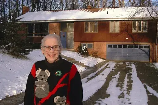 Ann T. Anthony poses for a photo on Dec, 26, 1998 in front of her home in Allison Park, Pa. (AP Photo/Ted Anthony, File)