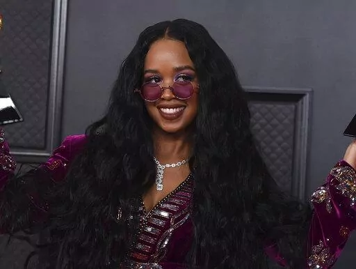 H.E.R. appears at the 63rd annual Grammy Awards in Los Angeles on March 14, 2021. The four-time Grammy winner will embark on her 19-city Back of My Mind tour in early April while separately joining Coldplay for their world tour as a supporting act later this month. (Photo by Jordan Strauss/Invision/AP, File)