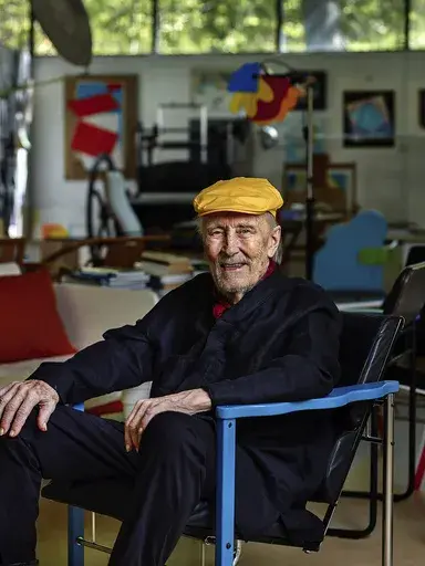 This undated image provided by Studio Kukkapuro shows Yrjö Kukkapuro, a renowned Finnish furniture designer whose postmodern style of chairs graced waiting rooms and museums alike, sitting in his famous Experimental chair in his studio outside Helsinki. (Studio Kukkapuro via AP)