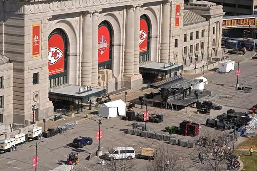 Workers dismantle the stage outside of Union Station Thursday, Feb. 15, 2024, in Kansas City, Mo. On Friday, Feb. 16, The Associated Press reported on stories circulating online incorrectly claiming a 44-year-old migrant was identified as one of the shooters at the Kansas City Chiefs’ Super Bowl parade on Wednesday. (AP Photo/Charlie Riedel, File)