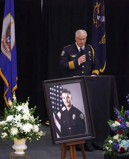 Fargo Police Chief David Zibolski speaks during funeral services for Fargo Police Officer Jake Wallin at Pequot Lakes High School in Pequot Lakes, Minn., on Saturday, July 22, 2023. Wallin, 23, was killed July 14 when a man armed with 1,800 rounds of ammunition, multiple guns and explosives ambushed officers responding to a routine traffic crash. (David Samson/Forum Communications Co. via AP, POOL)