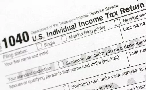 A portion of the 1040 U.S. Individual Income Tax Return form is shown July 24, 2018, in New York. The IRS said Tuesday, June 21, 2022, that it will have erased its backlog of last season's tax returns by the end of this week. (AP Photo/Mark Lennihan, File)