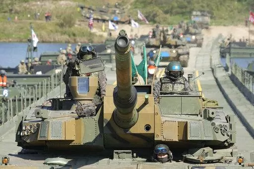 South Korean Army K2 tanks cross a floating bridge on the Namhan River during a joint river-crossing drill between South Korea and the United States in Yeoju, South Korea on Oct. 19, 2022. North Korea’s Foreign Ministry criticized the United States for expanding joint military exercises with South Korea that it claims are practice for a potential invasion and it warned Tuesday, Nov. 1, 2022 of "more powerful follow-up measures" in response. (AP Photo/Lee Jin-man, File)