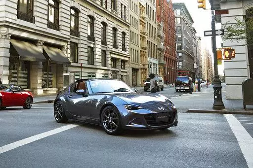 This photo provided by Mazda, shows the 2022 Mazda Miata MX-5 RF, a small rear-wheel-drive roadster with a retractable hardtop. (Courtesy of Mazda North American Operations via AP)