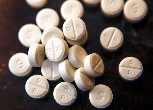This June 17, 2019, file photo shows 5-mg pills of Oxycodone.  The nation’s top public health agency on Thursday, Nov. 3, 2022, revised its controversial guidelines for U.S. doctors prescribing oxycodone and other opioid painkillers. (AP Photo/Keith Srakocic, File)
