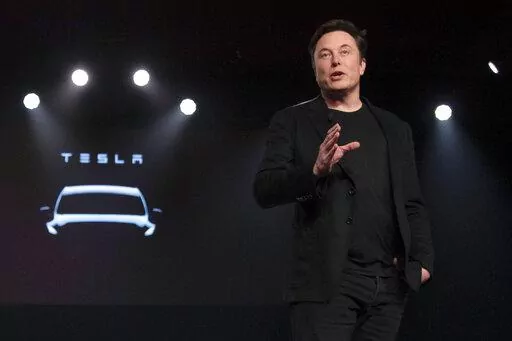 Tesla CEO Elon Musk speaks before unveiling the Model Y at the company's design studio on March 14, 2019, in Hawthorne, Calif. Musk is selling about 8 million Tesla shares worth nearly $7 billion as the billionaire looks to get his finances in order ahead of his court battle with Twitter. (AP Photo/Jae C. Hong, File)