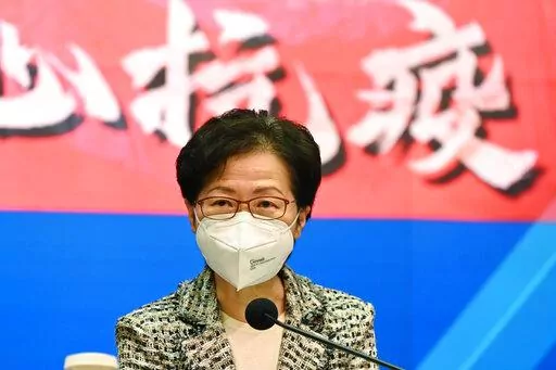 Hong Kong Chief Executive Carrie Lam speaks during a news conference at the government headquarters in Hong Kong, Wednesday, March 9, 2022. Hong Kong's chief executive said Sunday, March 20, that the government would consider lifting strict social distancing measures as new infections in the city continued trending downward.(Peter Parks/Pool Photo via AP, File)