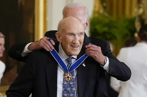 President Joe Biden awards the nation's highest civilian honor, the Presidential Medal of Freedom, to former Wyoming Sen. Alan Simpson at the White House in Washington, July 7, 2022. Simpson has died at age 93. (AP Photo/J. Scott Applewhite, File)